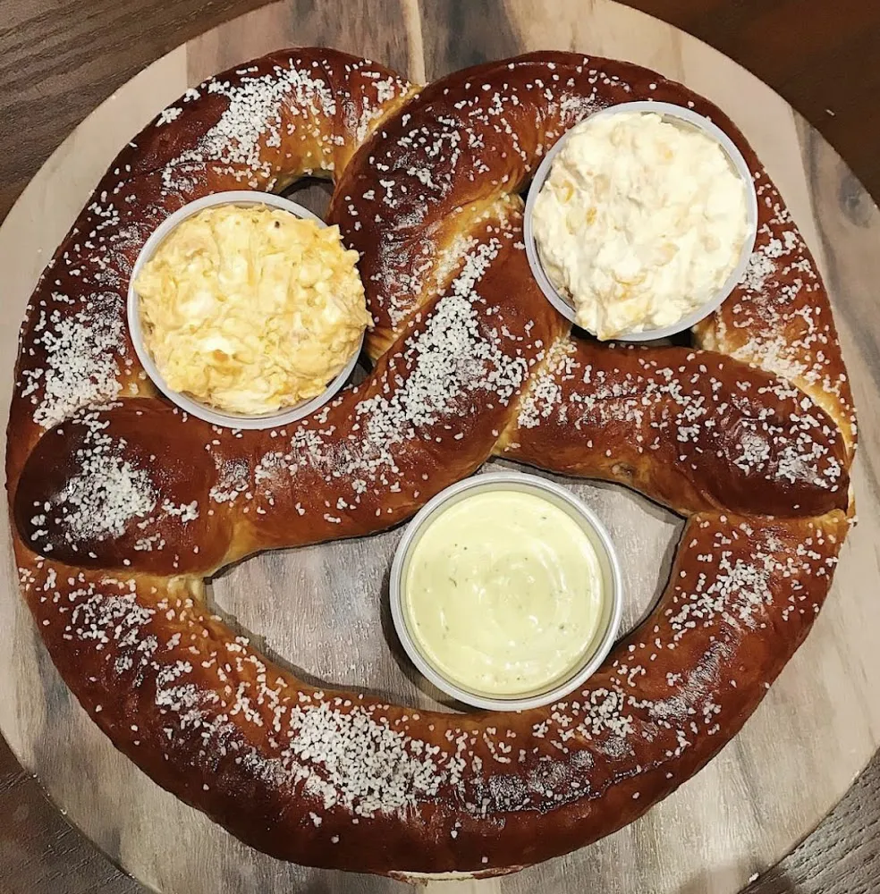 Supersized Pub Pretzel with Signature Beer Cheese Pub Mustard and Queso Dip